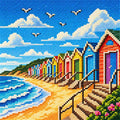 Full diamond painting of colorful beach huts along a sunny seaside, featuring blue ocean waves, golden sand, fluffy clouds, distant green hills, and sparkling resin diamond drills.