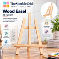 A light natural wood easel displayed on a tabletop in a bright indoor setting, with product text, icons, and an inset showing the easel from the back. The brand name TheSparkleGrid is visible at the top.