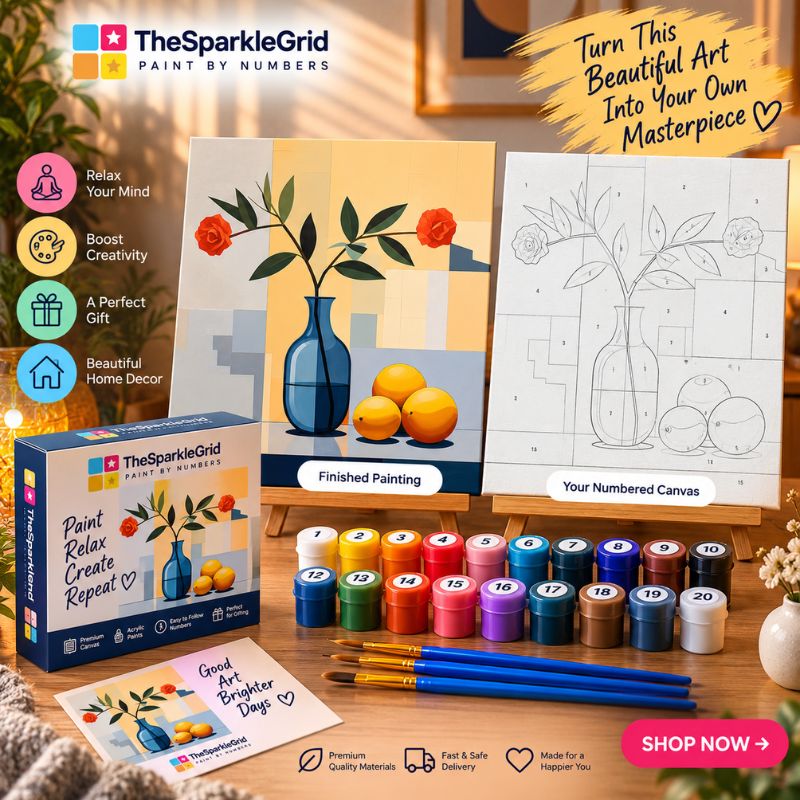 The SparkleGrid Paint by Numbers kit displayed on a wooden table, showing the colorful paint box, a finished painting of a blue vase with oranges, a numbered canvas with floral line art, a set of watercolor paints, paintbrushes, and printed cards. The scene is styled with warm home decor elements in the background.