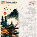 TheSparkleGrid paint by numbers kit featuring a Japanese-inspired mountain landscape, finished and numbered canvas, acrylic paints, brushes, and branded packaging arranged on a cozy wooden table.