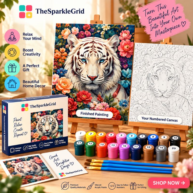 TheSparkleGrid white tiger paint by numbers kit promotional image featuring a finished floral tiger painting, numbered canvas, colorful acrylic paints, brushes, branded packaging, and creative workspace